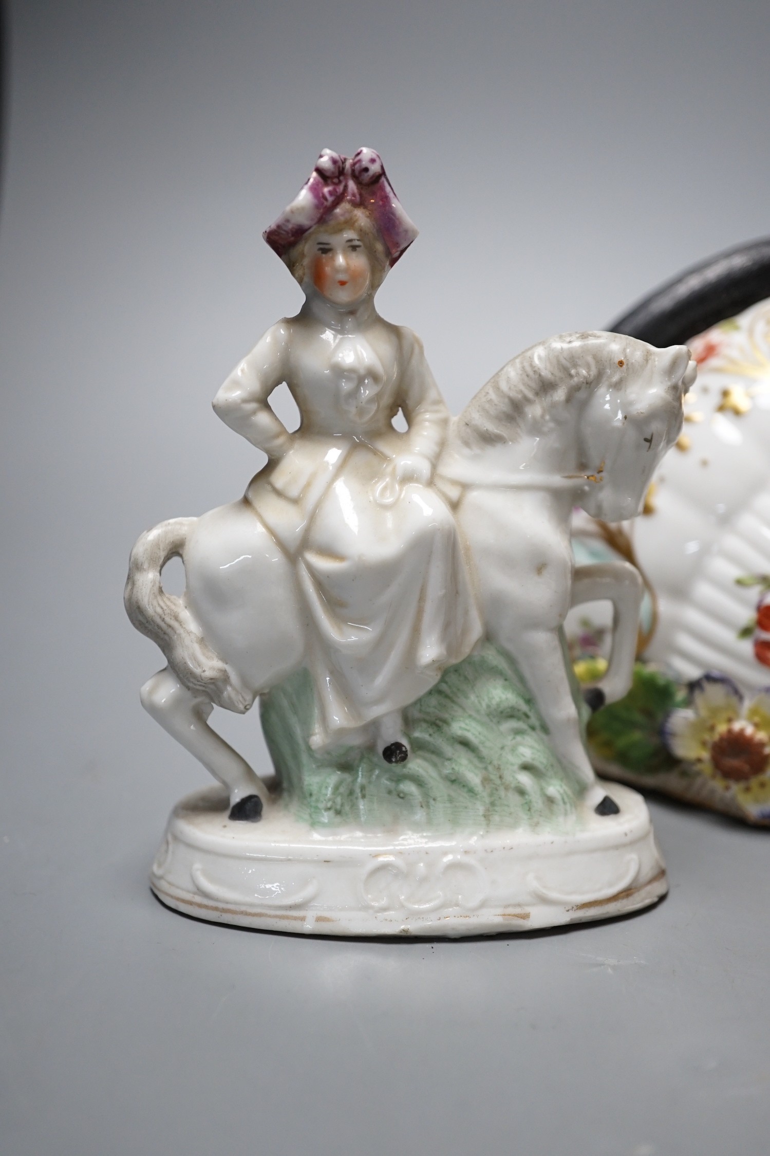 A pair of Dresden porcelain wall brackets and a pair of porcelain horses and riders, 12cm tall